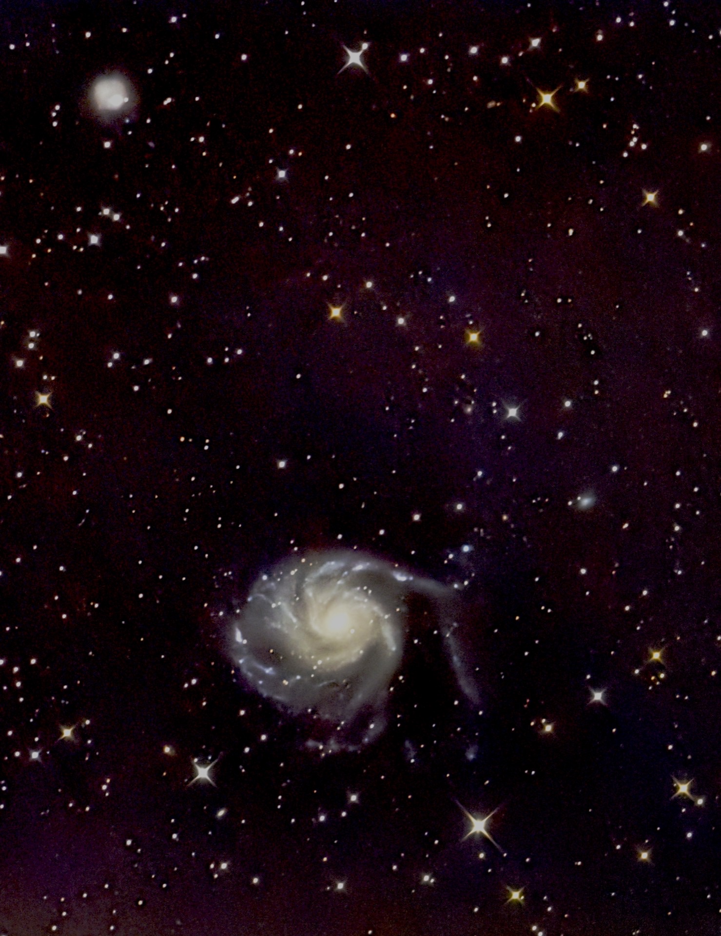 The Pinwheel Galaxy, a face-on spiral with a warm core.
