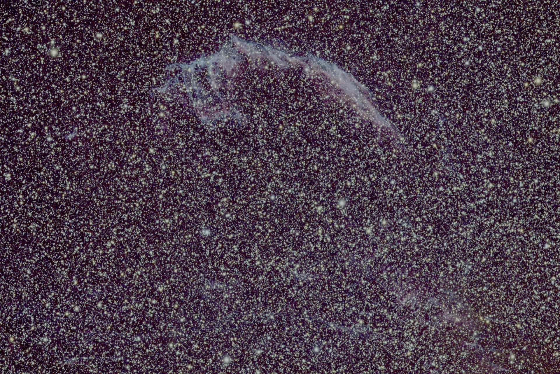 The Western Veil, a filament of blue and rose in the Cygnus Loop.