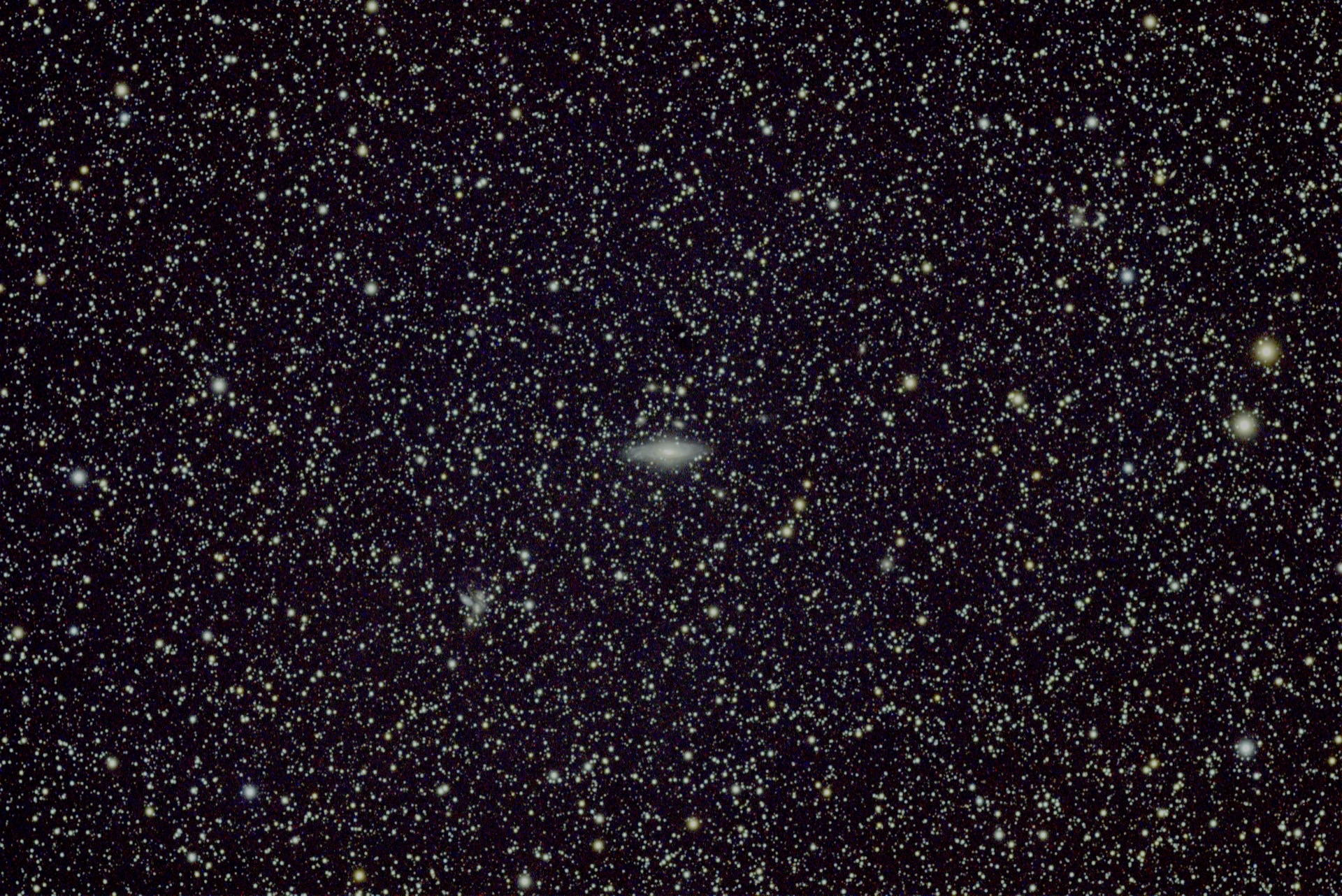 NGC 7331, a small edge-on spiral in a dense star field.